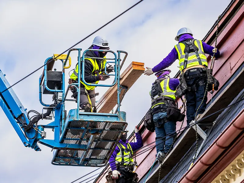 Workers on a steep roof